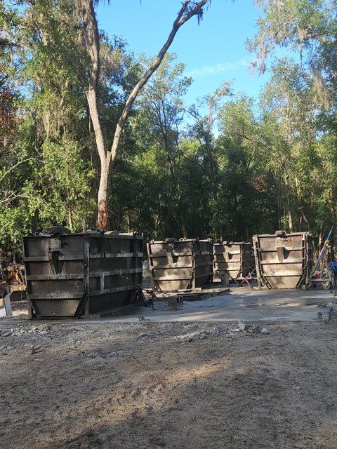 Steel forms used to cast precast concrete septic tanks at the Bonded Septic Tank manufacturing yard in Hernando, Florida