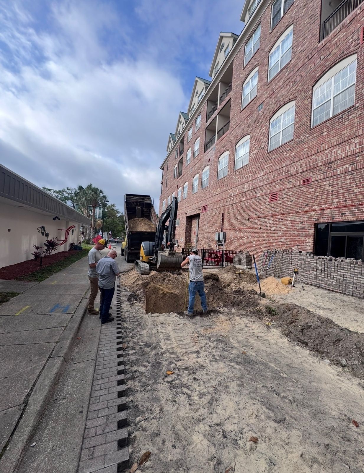 Bonded Septic Tank crew installing a specialized septic system on a Florida commercial site